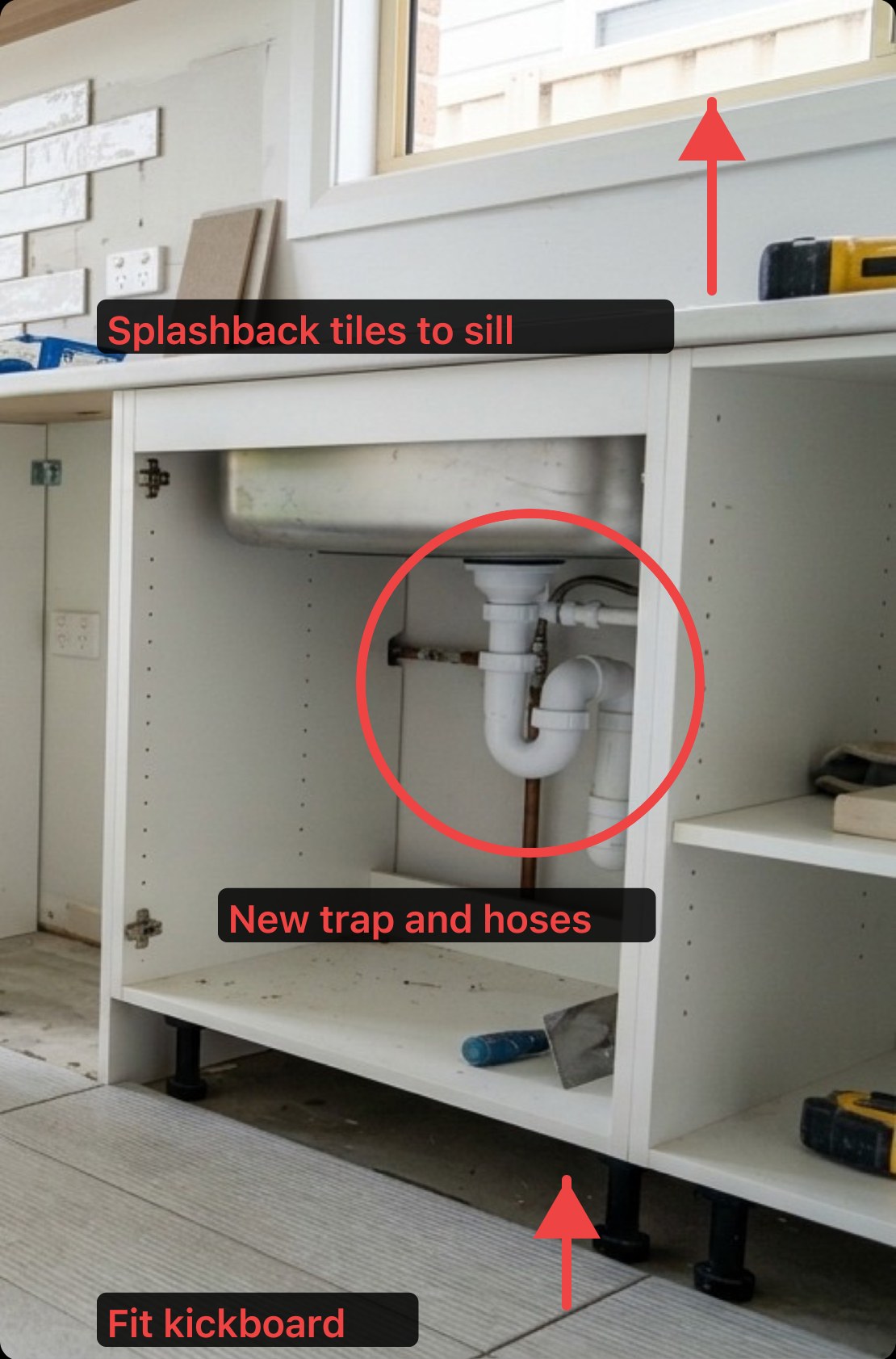 A laundry under-sink cabinet photo marked up in QuoteMate: a red circle around the trap labelled 